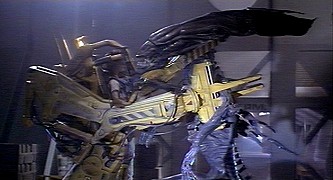 The Queen held by Ripley in the power loader